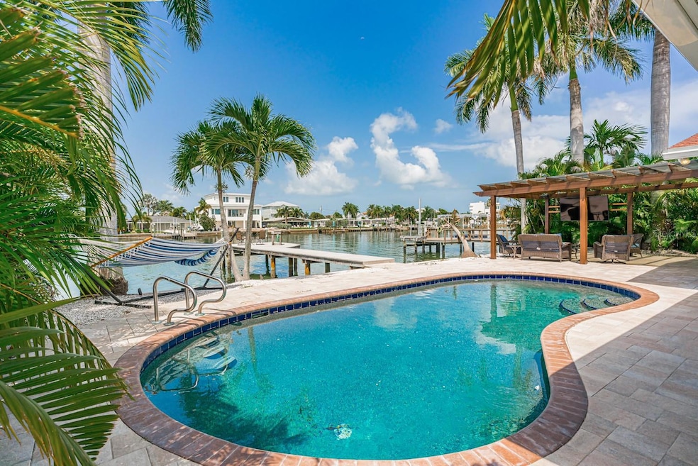 Nice refreshing pool looking out to the dock and canal.