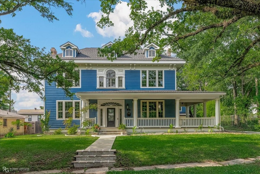 View of front of house featuring covered porch and