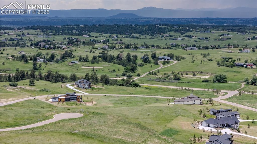Aerial view of Lot 56 with rolling hills and panoramic Front Range views