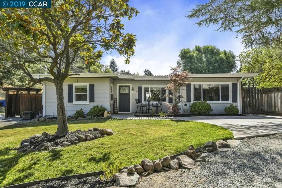 Sits this darling home with curb appeal that doesn