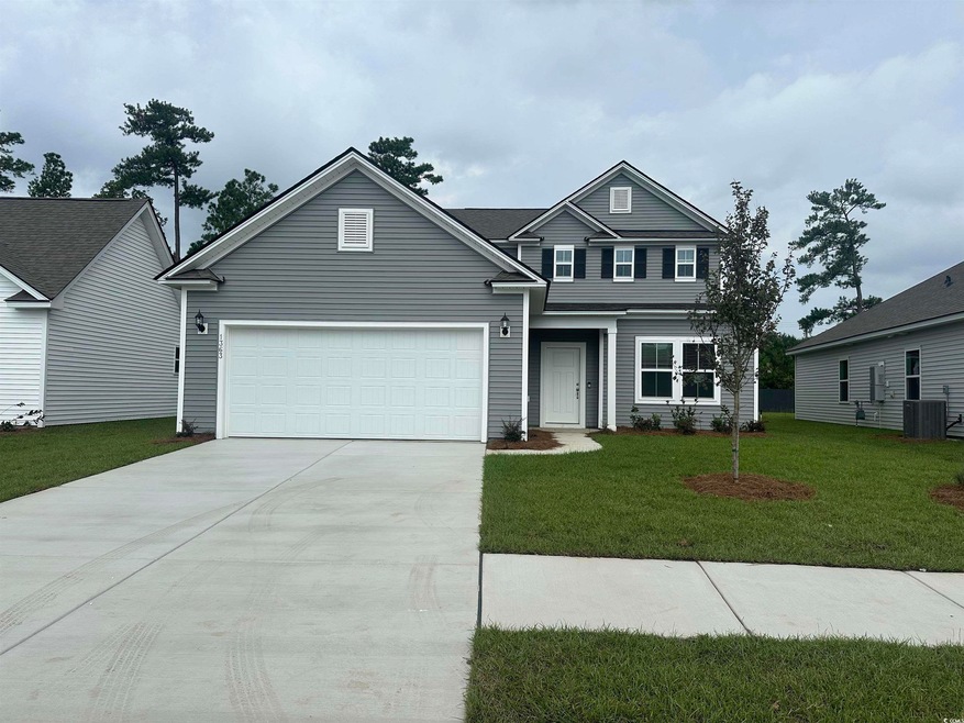 View of front of home with cooling unit and a fron