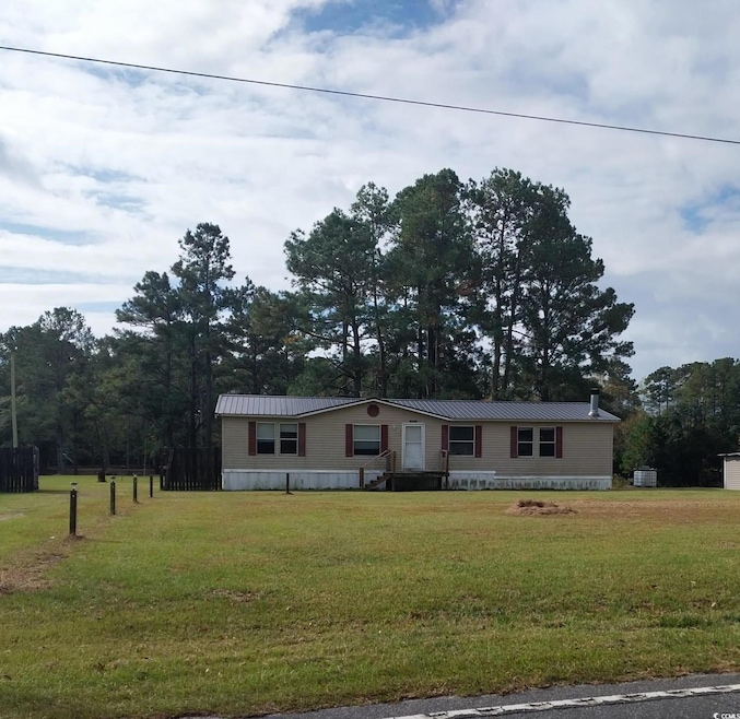 View of front of property with a front yard