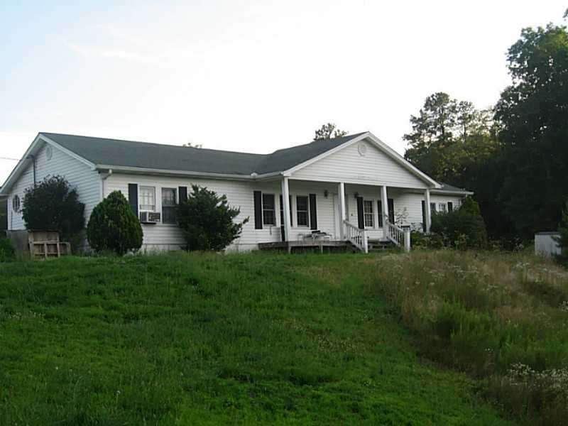 Exterior Front. Wonderful Paces Lakes 4 BR home si