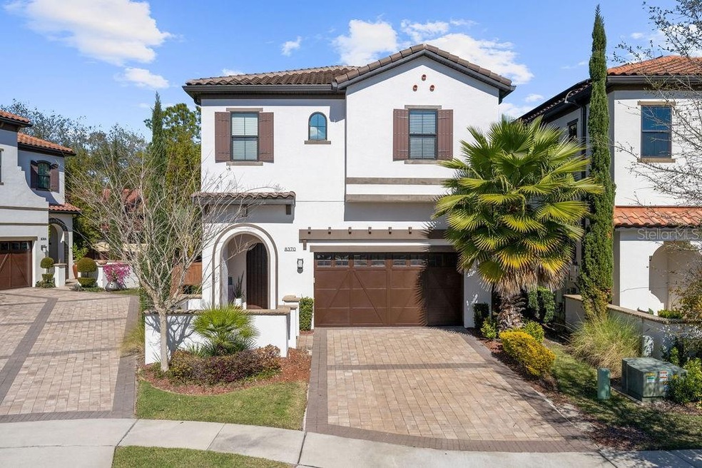 Front elevation...featuring brick paver driveway a
