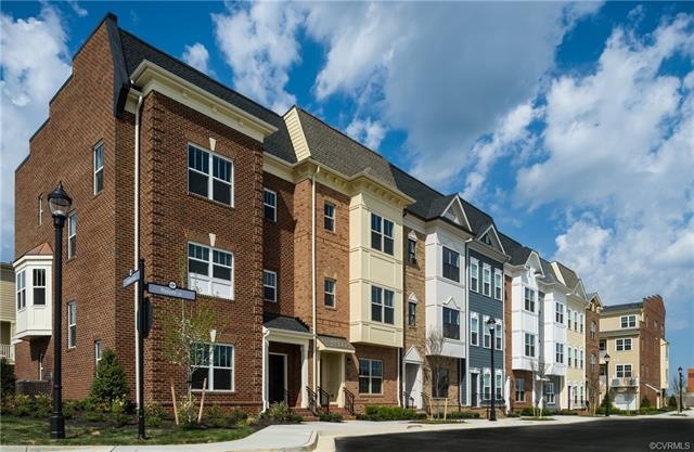 This home is not yet built. Image is a visual representation of a townhome exterior.