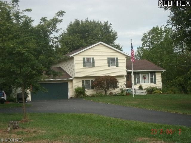 Paved drive for this country property is a real as