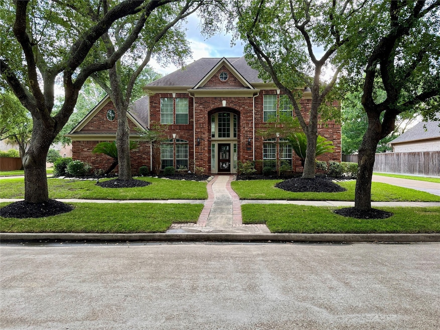 Outstanding curb appeal accentuated by mature, att