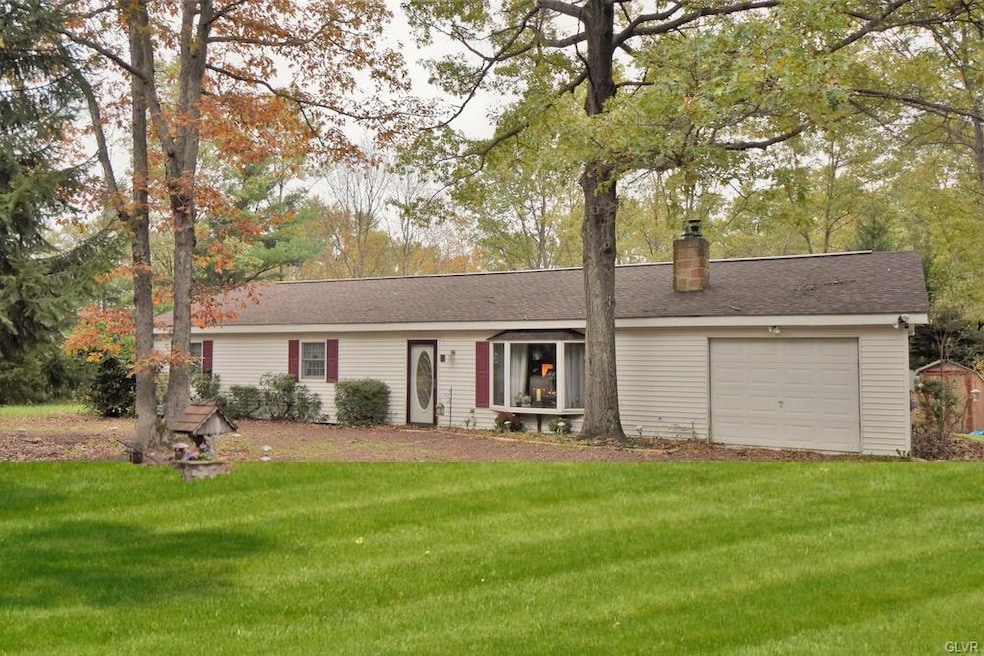 Front of home nestled in private wooded setting