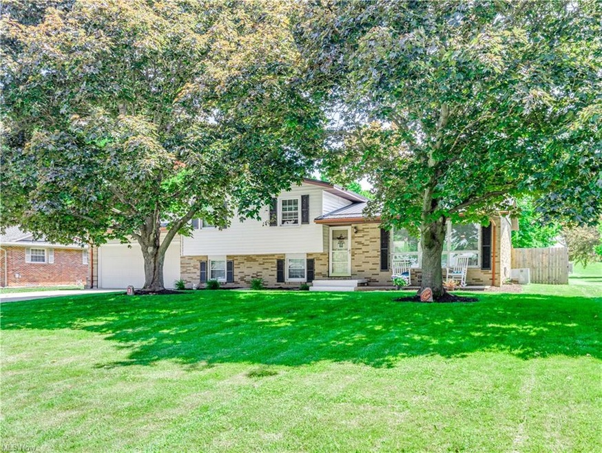 Welcome to this lovely split-level brick home!