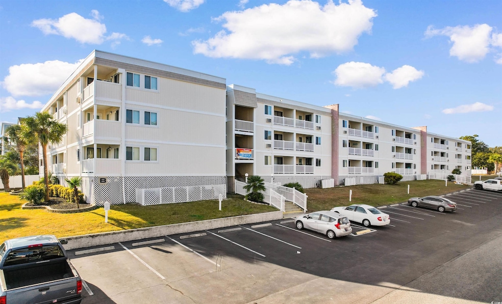 View of building exterior featuring uncovered park