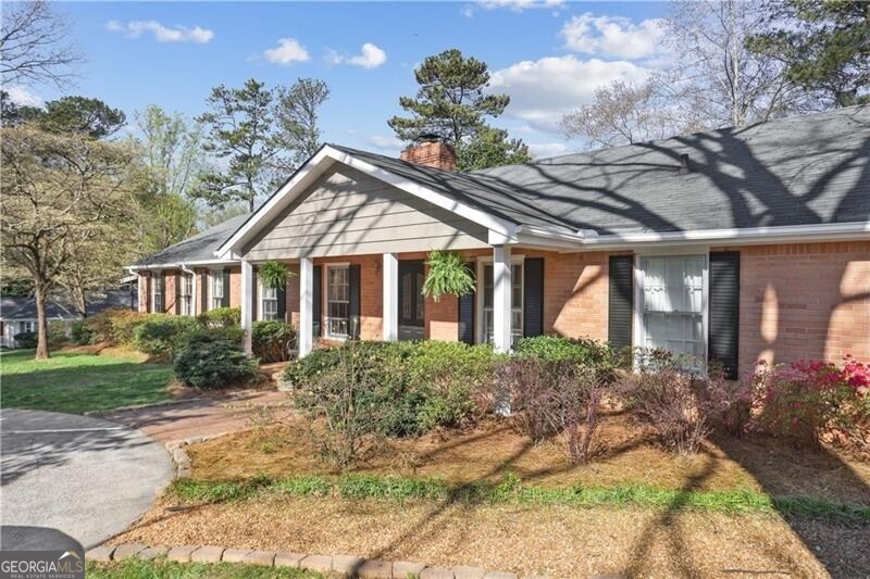 View of front of property with a front lawn, a chi