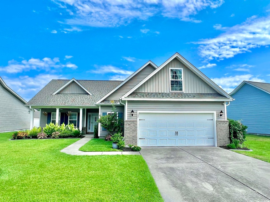 Craftsman-style home with a front yard