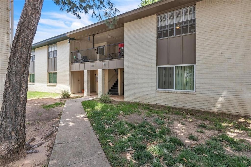 View of property featuring stairs
