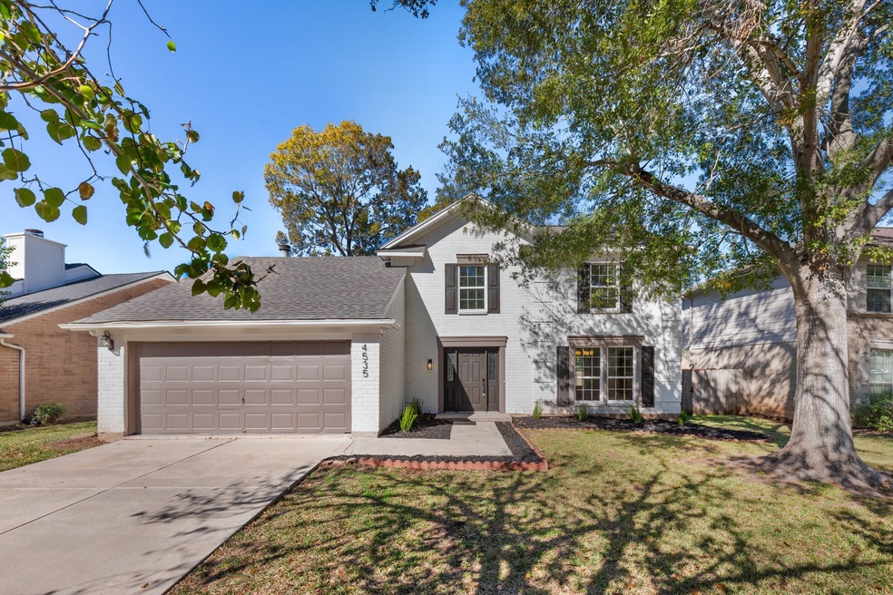 Charming two-story home. Features a spacious two-c