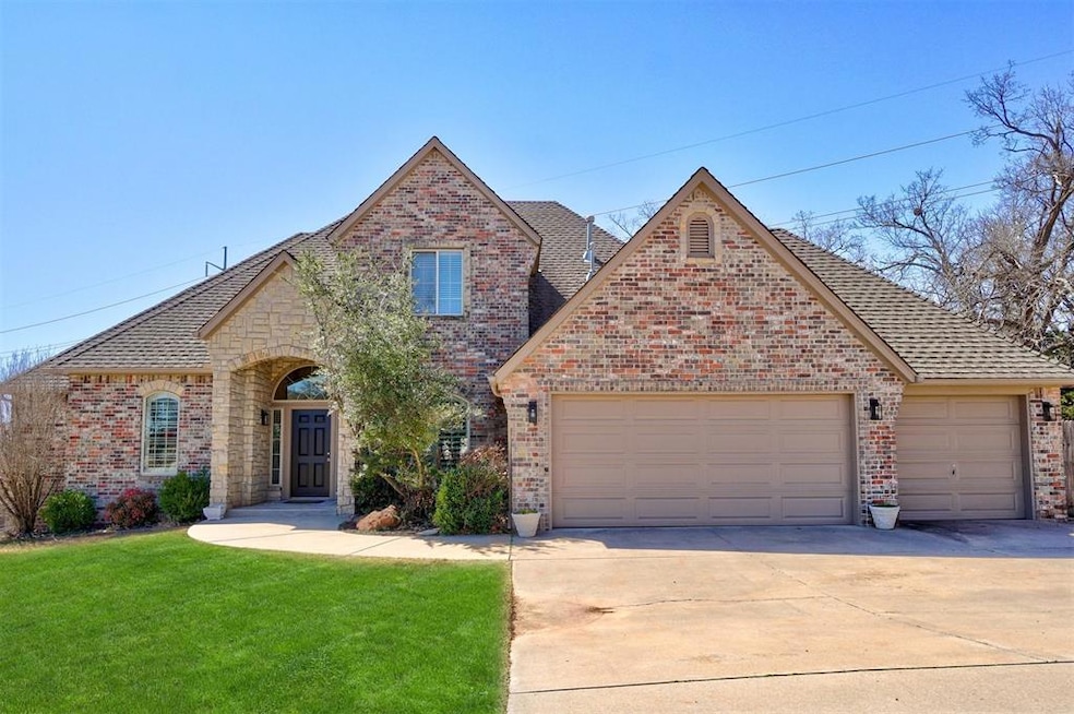 View of front of house featuring concrete driveway, an attached garage, brick siding, and a front yard