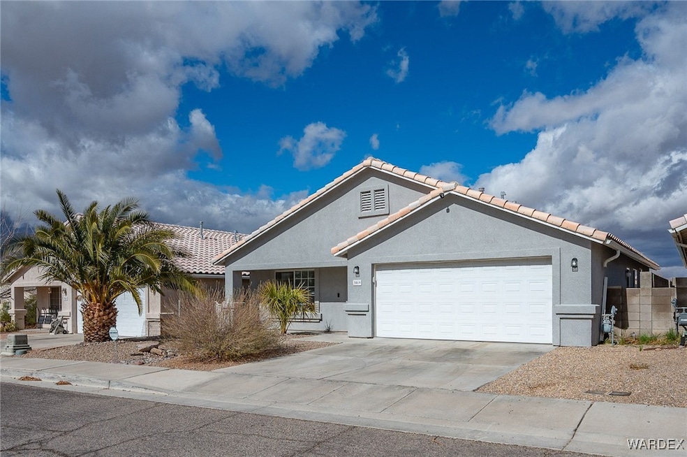 Ranch-style house featuring a garage