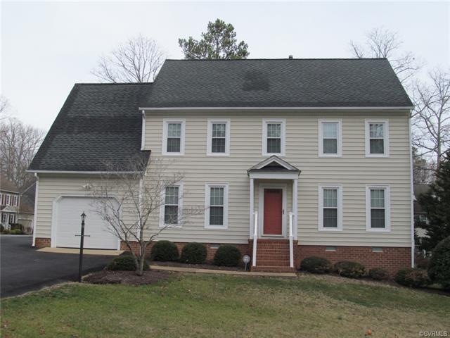 Front view of well maintained two story with vinyl