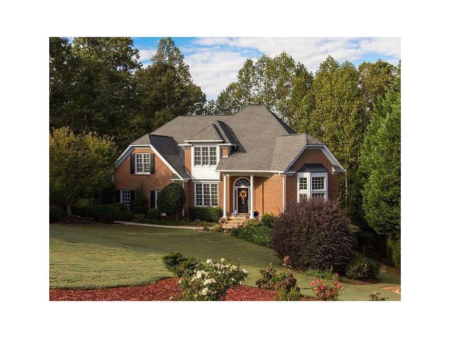 Exterior Front. Elegant 3-sided Brick Home on .75 