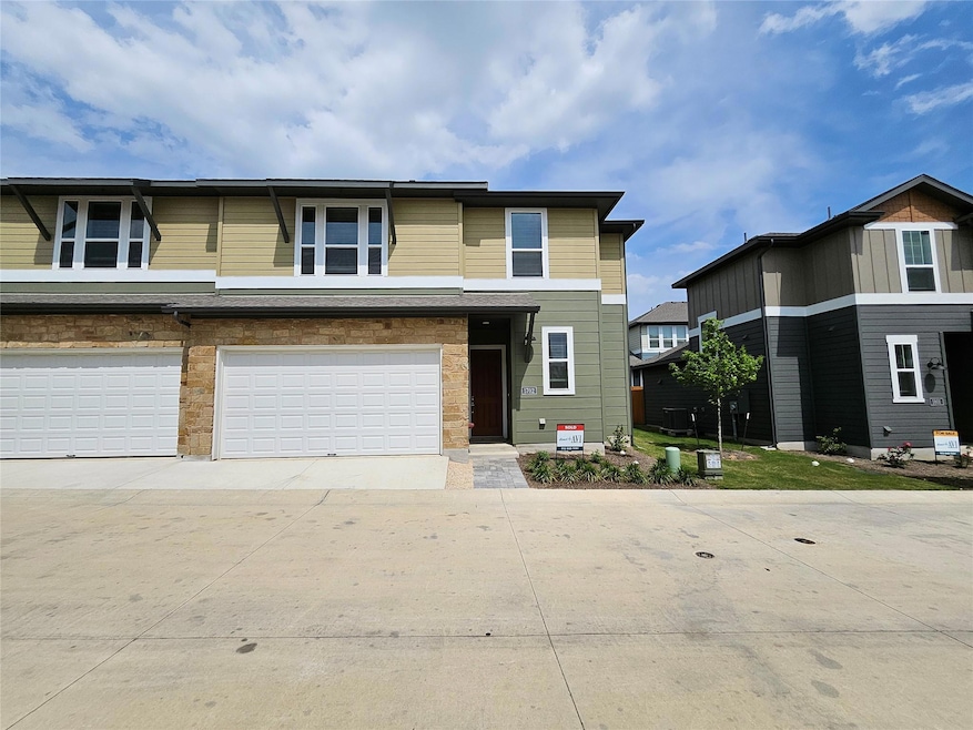 View of front of house with a garage and driveway