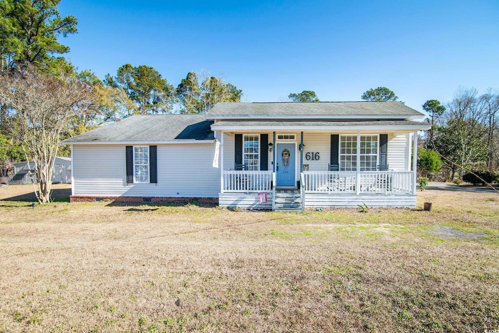 Single story home featuring a porch and a front la
