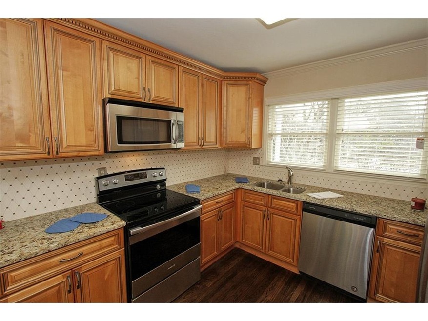 KITCHEN WITH NEW CABINETS, NEW GRANITE COUNTER TOPS AND NEW STAINLESS STEEL APPLIANCES!