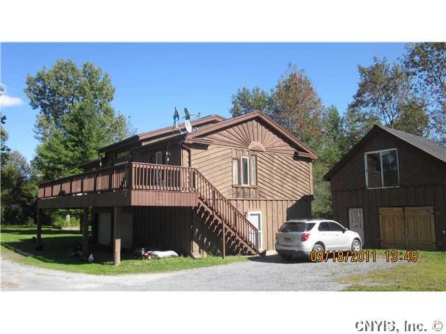 Exterior Front. 2 Car Garage under the house with 