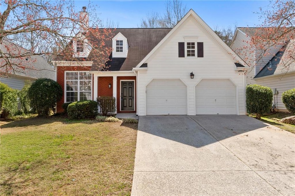 View of front of house, featuring driveway, an att