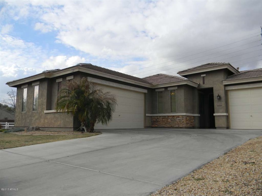 3 Car Garage and Stone Front