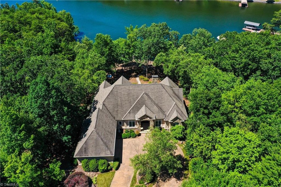 Welcome to your gorgeous lake front estate with circle drive!  Single level living at it's finest in Uwharrie Point at The Old North State Club!