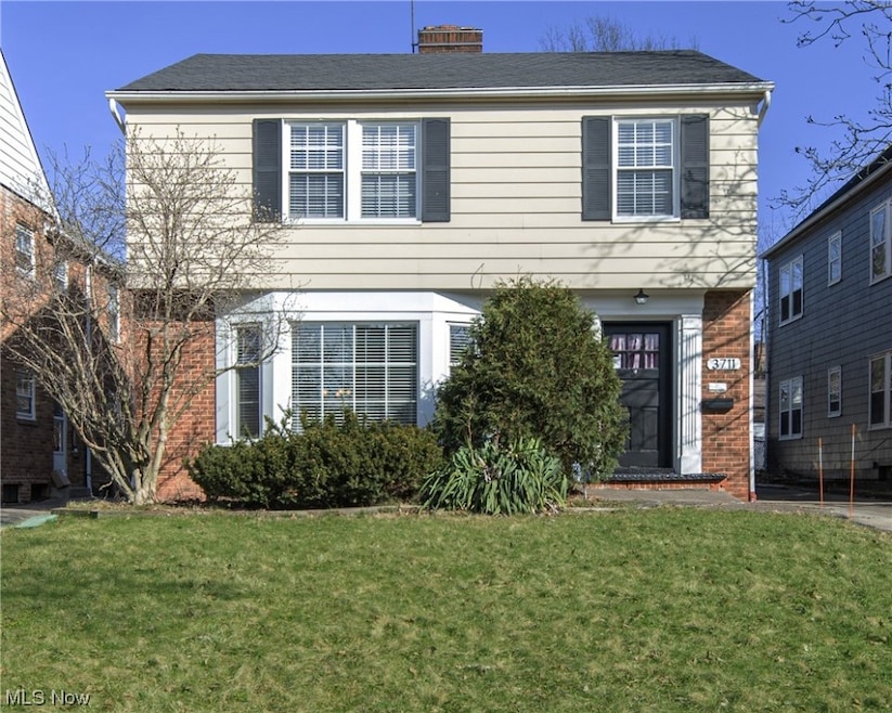 View of front of house; note the lovely windows and architectural interest!