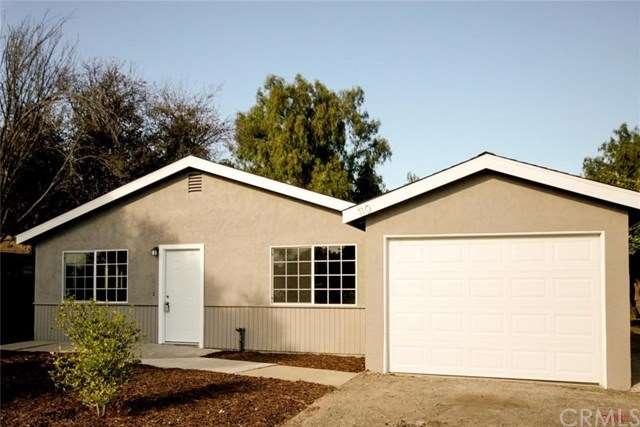 Great curb appeal with new landscaping, paint, gar