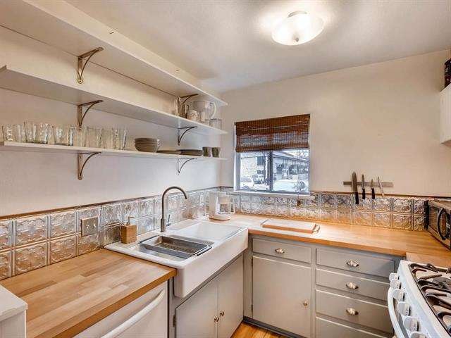 Embossed aluminum tiles, butcher block counters an