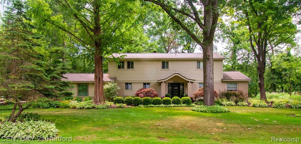 BEAUTIFULLY UPDATED COLONIAL ON 1/2 ACRE WOODED LO
