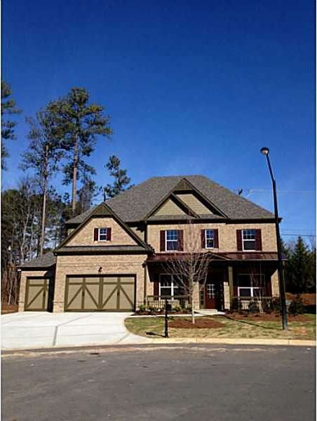 Exterior Front. 3-sides brick, 3-car garage, front