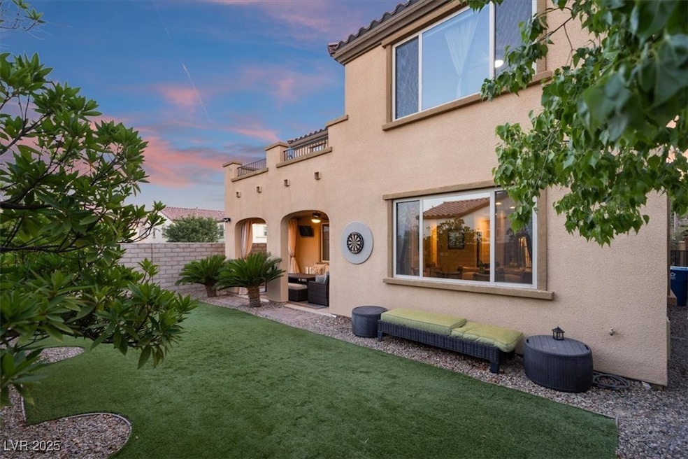 Step outside to relax underneath the covered patio, surrounded by backyard space designed for effortless outdoor living. Experience the new standard of Summerlin luxury in this stunning corner-lot gem, situated behind a gated community in the prestigious village of The Paseos.