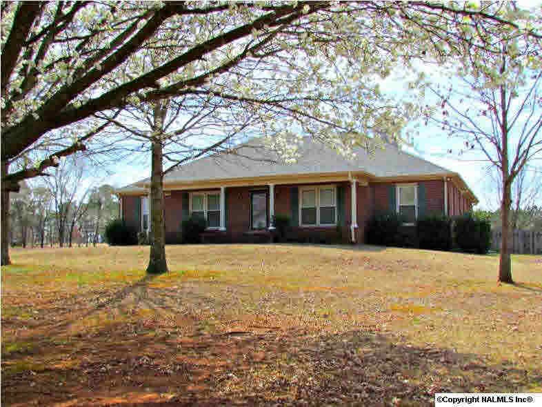 Situated on 1.5 Acres in quiet country setting just minutes away from schools, shopping and hwy access