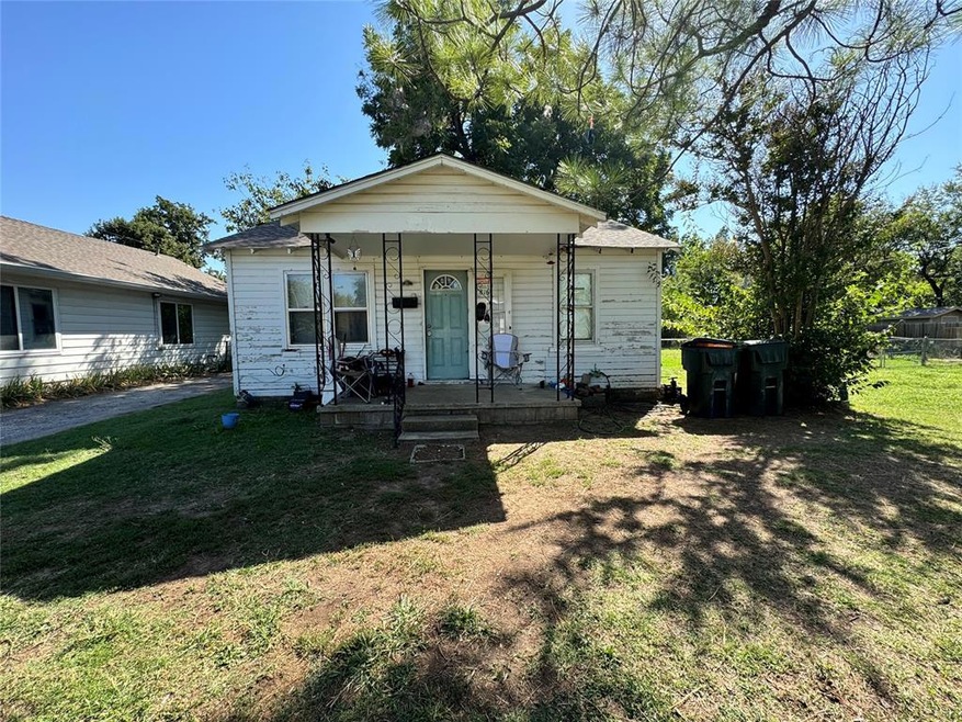 View of front of property with covered porch and a