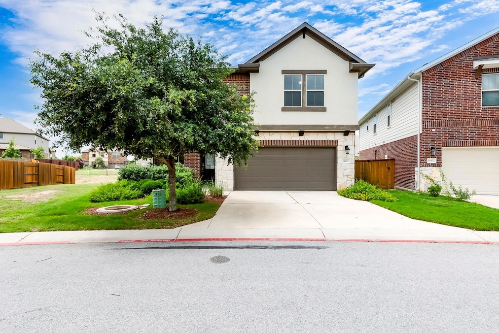 Traditional-style home with a garage, concrete dr