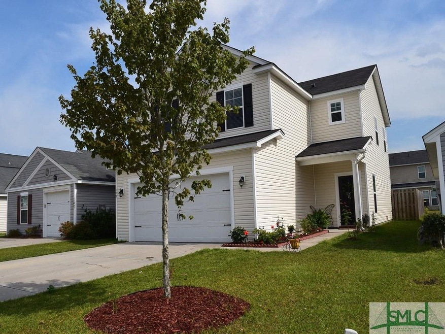 Front view of home.  Well landscaped yard.