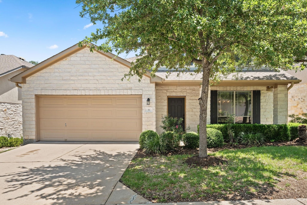 Ranch-style home with an attached garage, concret