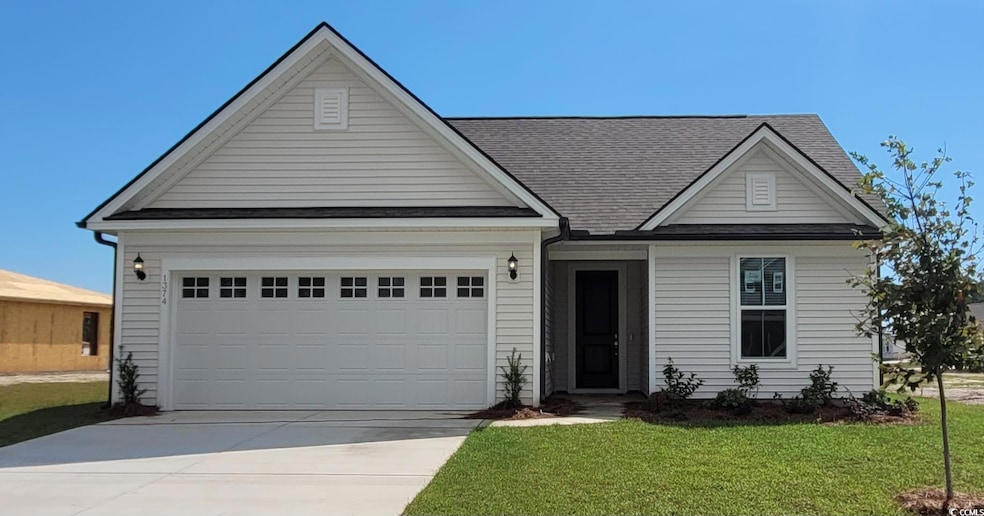 View of front facade featuring a front lawn and a 