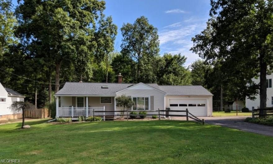 Front view with split rail fence and extra parking