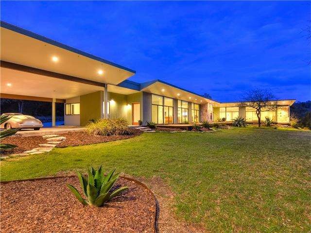 Carport entry with covered walkway overlooking back courtyard