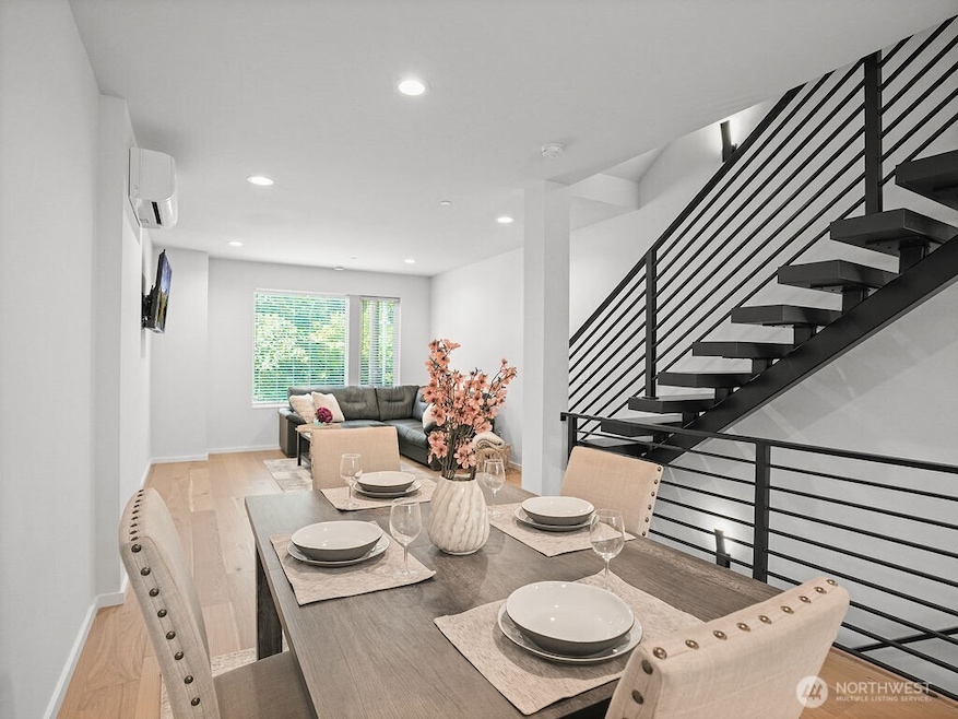 Beautiful, bright dining & living areas with floating staircase.