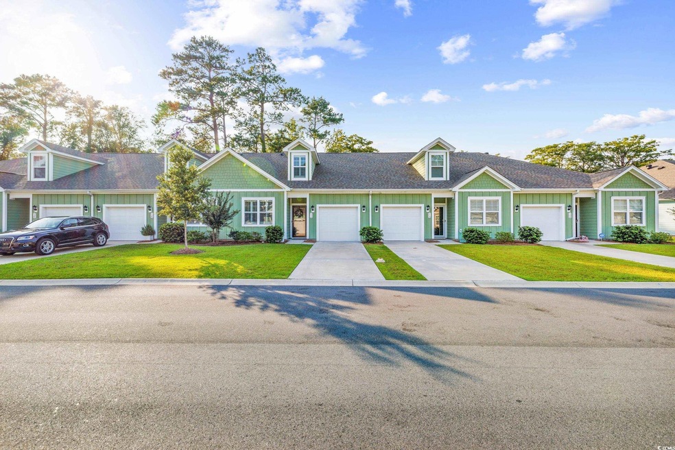 View of front of property featuring a garage and a
