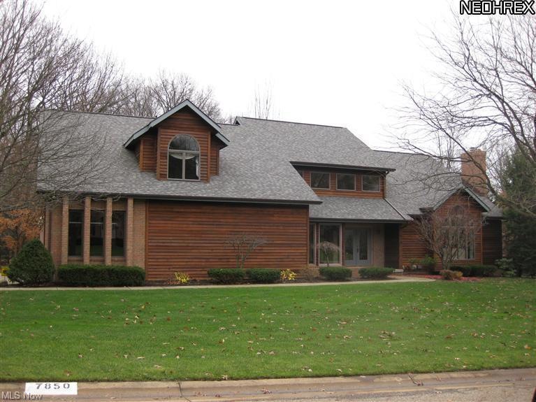 Beautiful two story cedar home with mature landscaping.