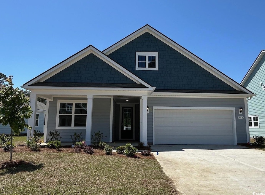 Craftsman-style home featuring a garage, driveway,