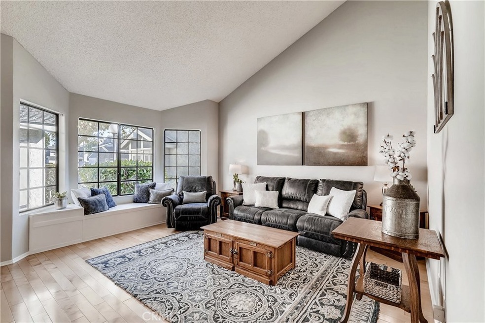 Hardwood Floors, Vaulted Ceilings, Bay Windows w/Built-in Window Seating & Freshly Painted.