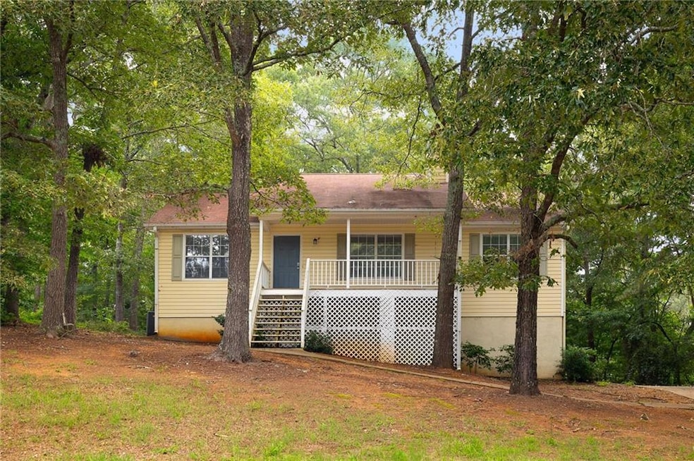 View of front of property featuring covered porch and stairway