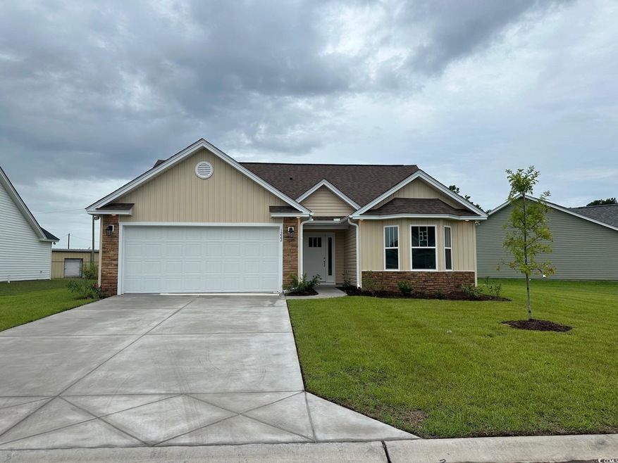 View of front of property featuring a garage and a